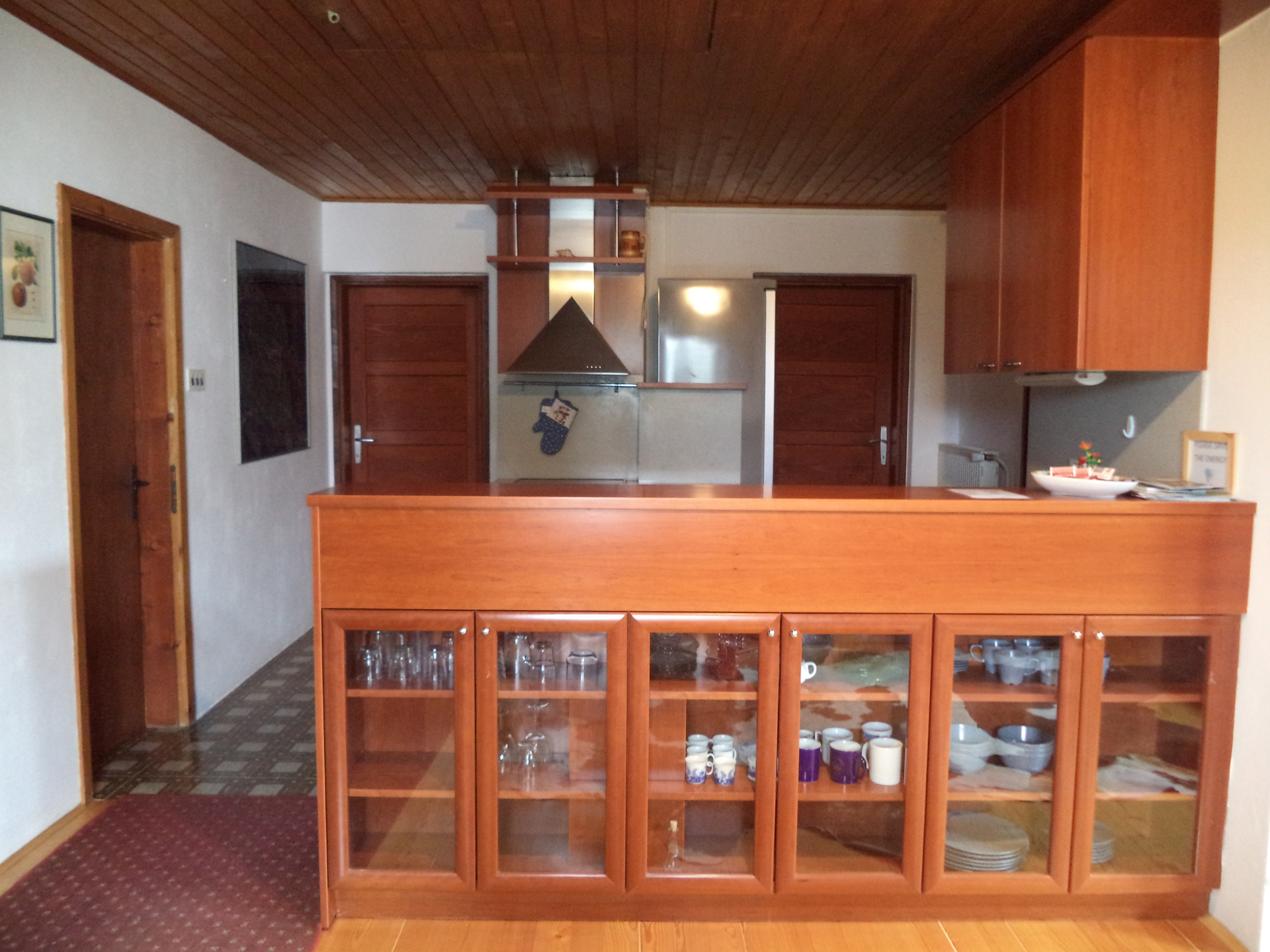 A view of the kitchen from the dining room.