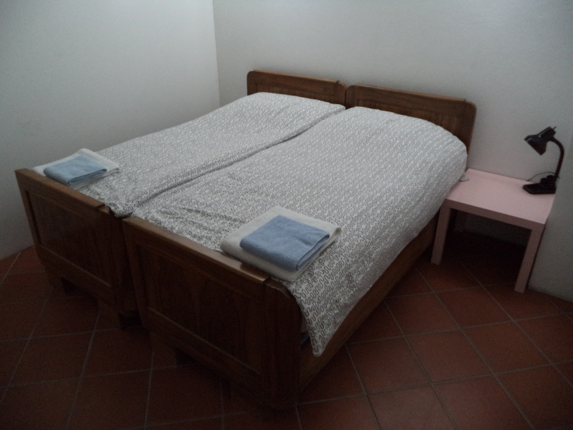 The double beds in the main bedroom