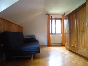 The other bedroom, complete with couch and bunk bed.