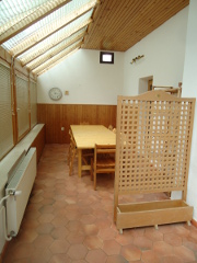 There is a veranda in the ground floor of the house available for seating.
